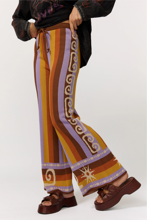 Colorful patterned pants with a white background