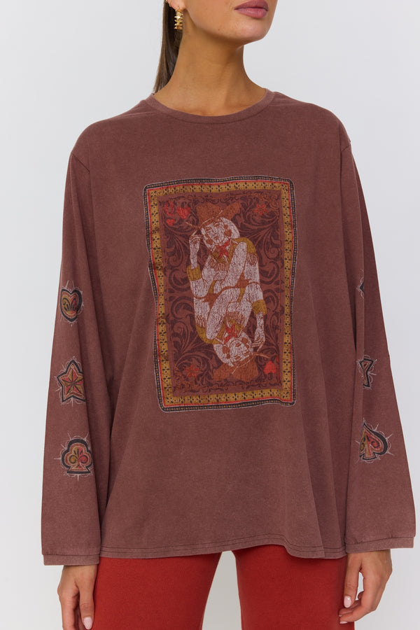 Brown long-sleeve top with a central graphic design on a white background