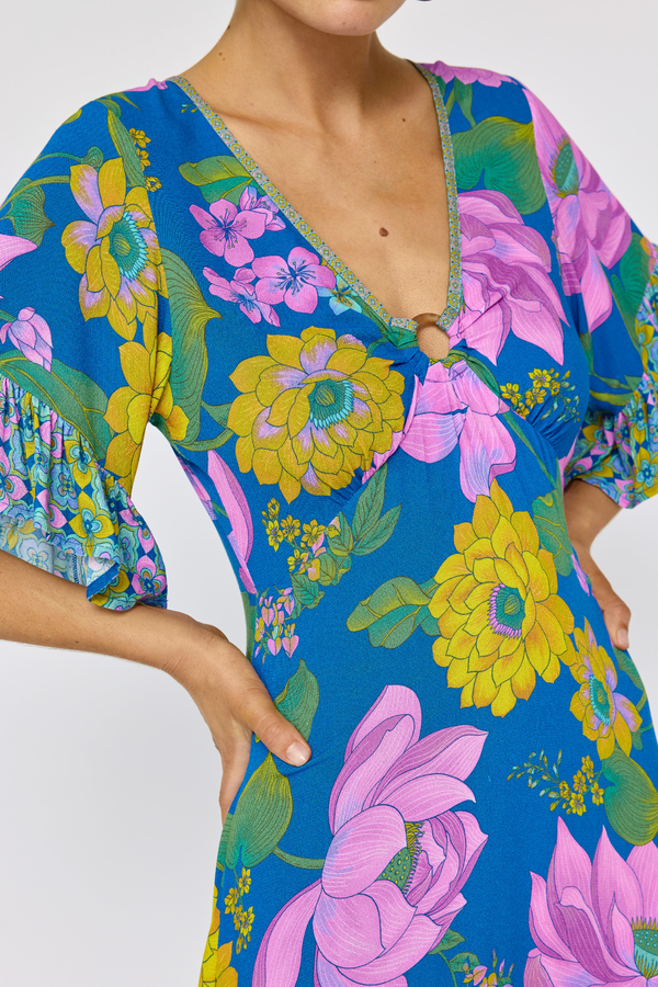 Colorful floral dress with a blue background