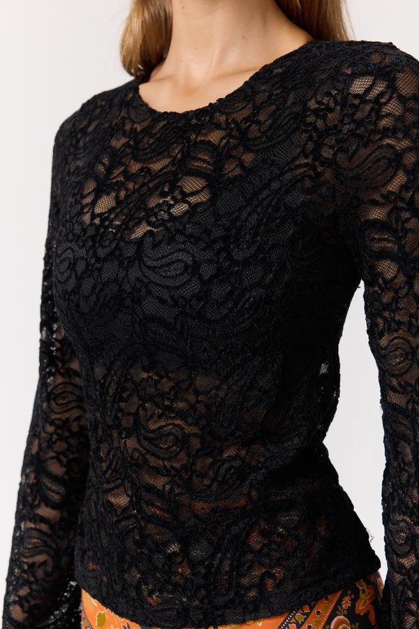 Black lace long-sleeve top on a plain background